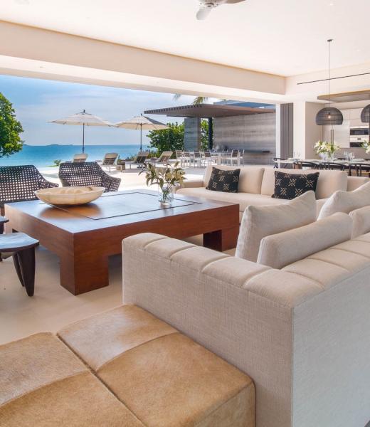 Upon arrival at Casa Afrique, you are greeted by a stunning courtyard adorned with swaying palms, setting the tone for the tranquil elegance that awaits within. This lush entryway leads to a masterful open-plan living area that seamlessly blends indoor and outdoor spaces, epitomizing coastal luxury. With direct beach access from the beautifully...